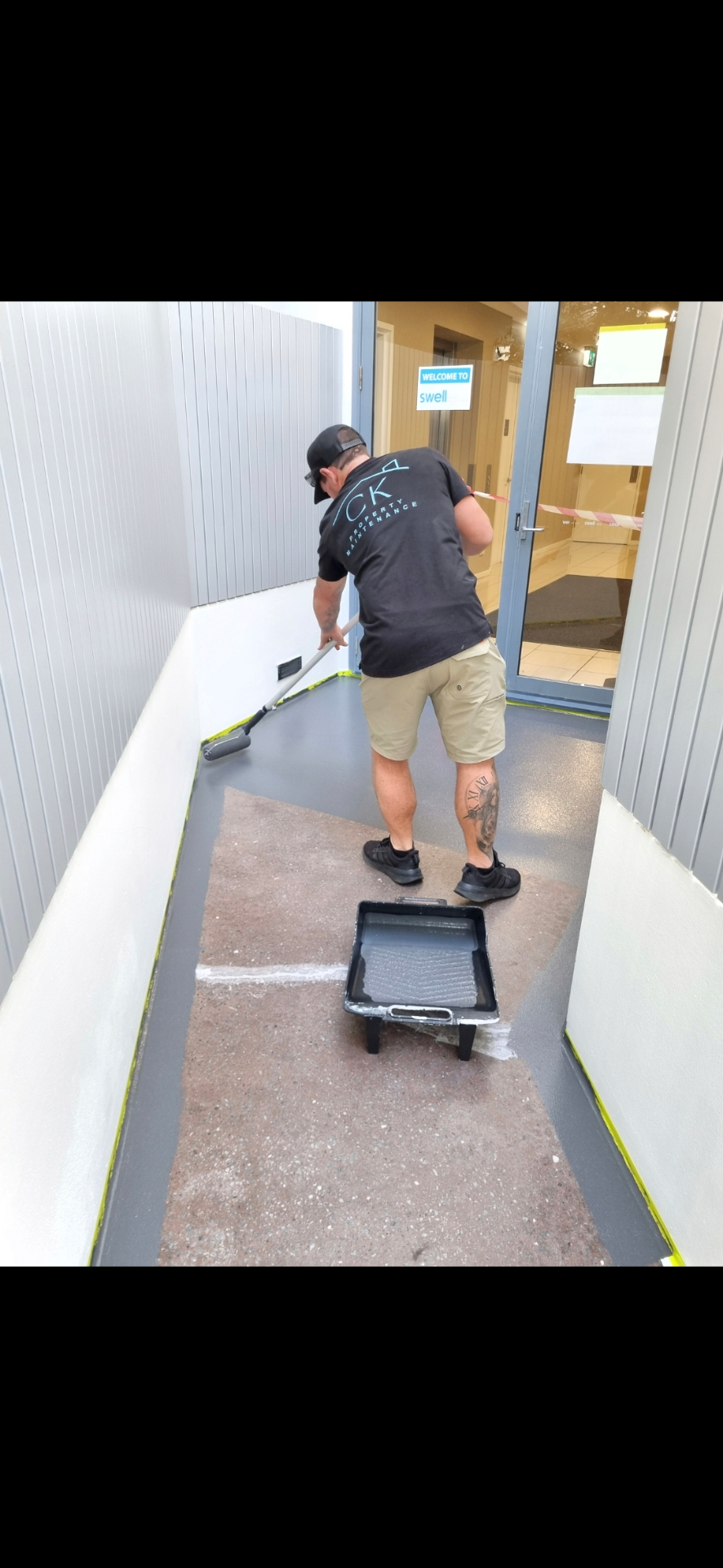 Entry walkway receiving protective floor coating