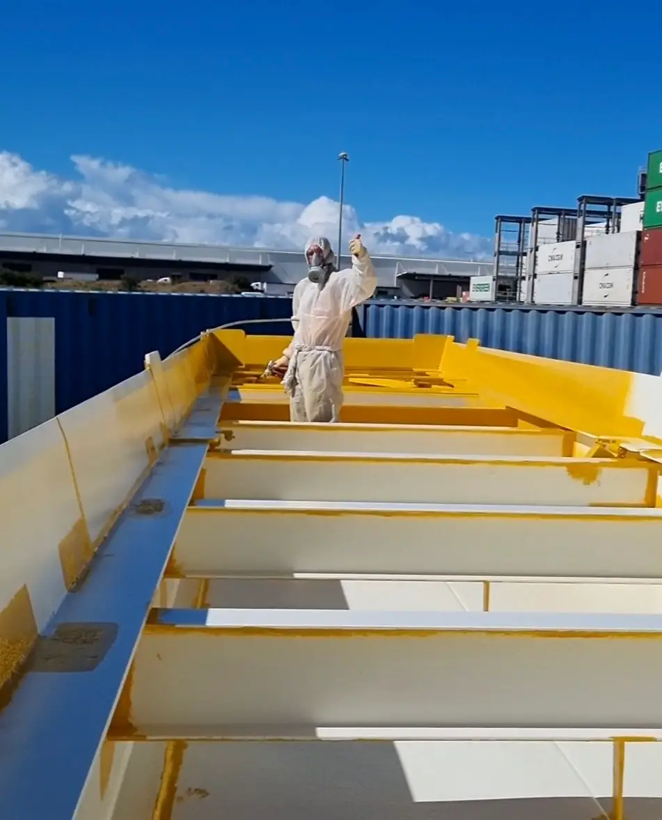 Industrial spray painting on structural steel