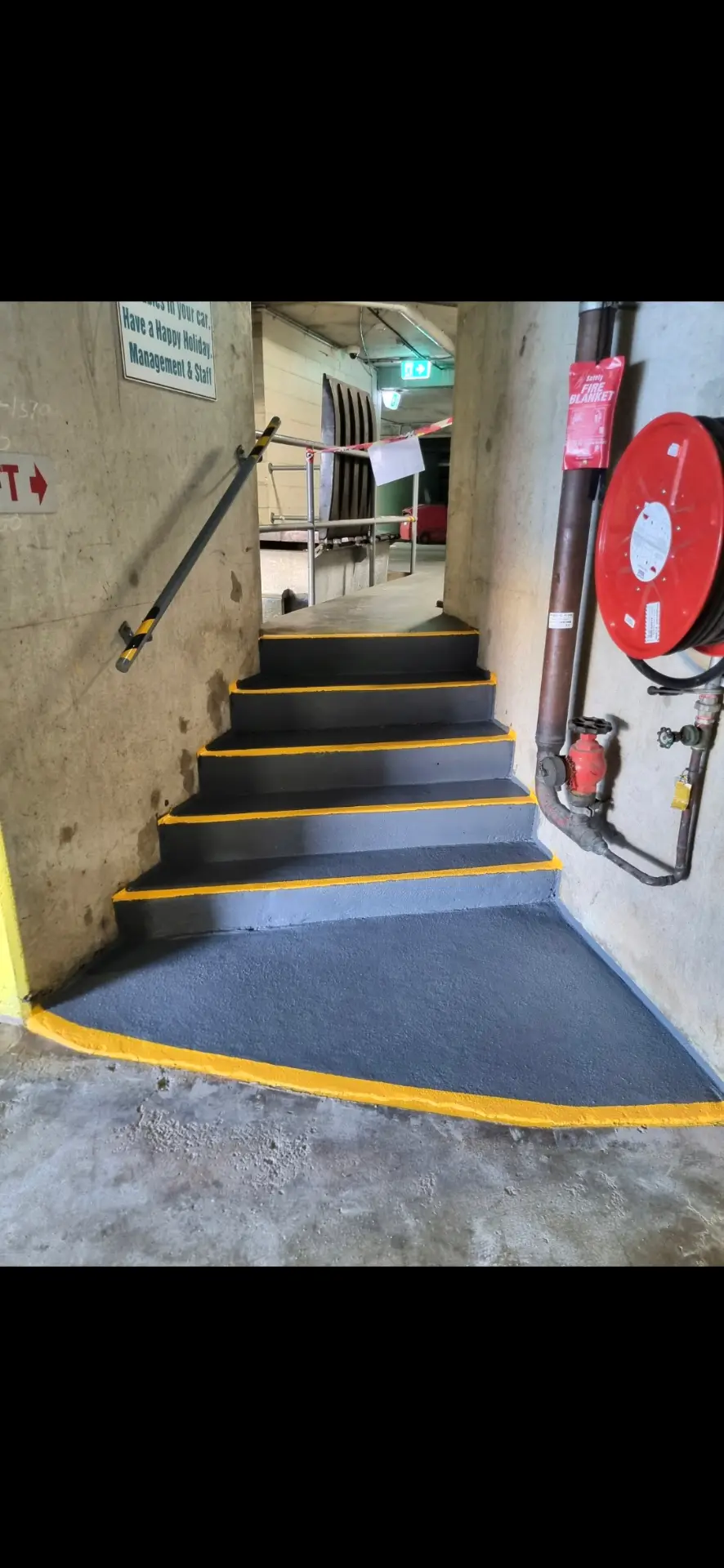Car park stairwell after epoxy coating and line marking